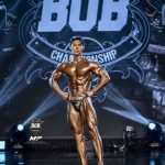Eric Song Peng posing on stage at BOB Championship, Seoul