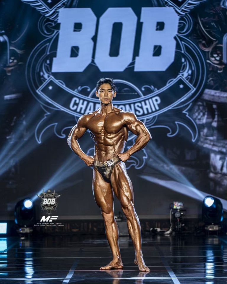 Eric Song Peng posing on stage at BOB Championship, Seoul